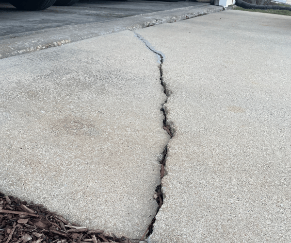 An example of a concrete driveway that would benefit from polyurethane concrete leveling.