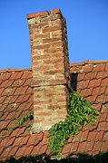 Leaning chimney repair by Foundations on the Level
